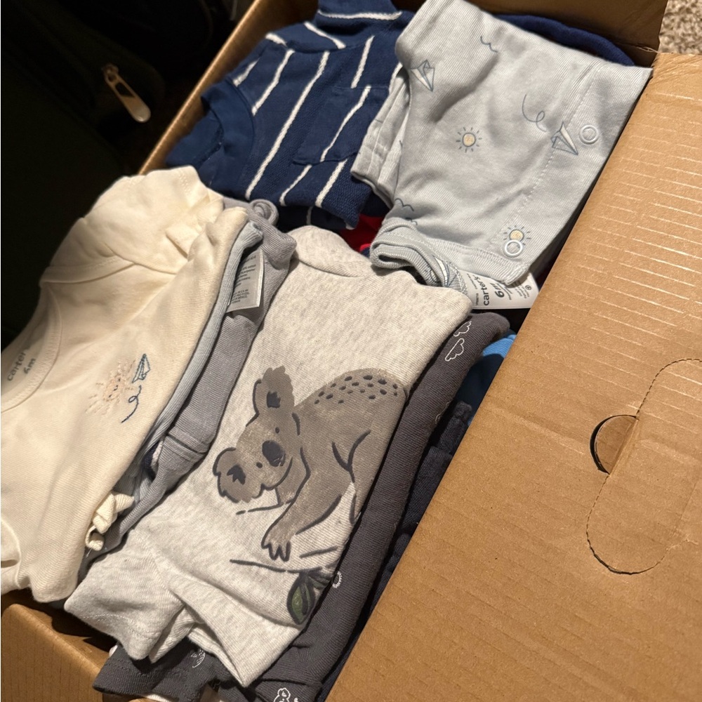 Box of baby boy clothes